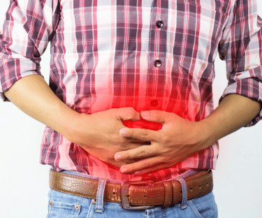 Man holding his stomach in pain